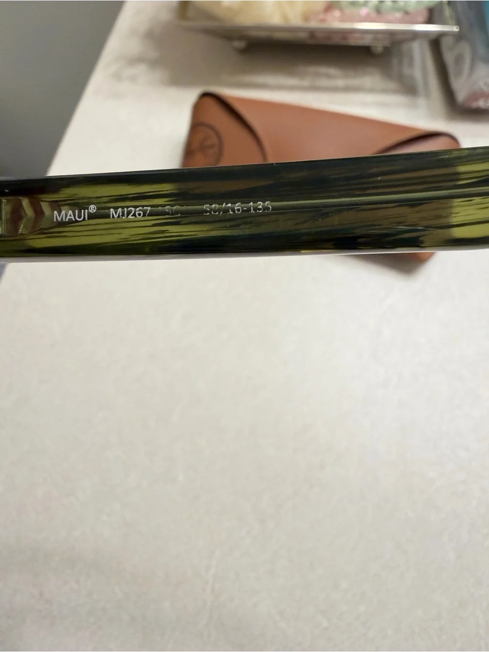 Maui Jim Black Frame Sunglasses with Green-Tinted Lenses